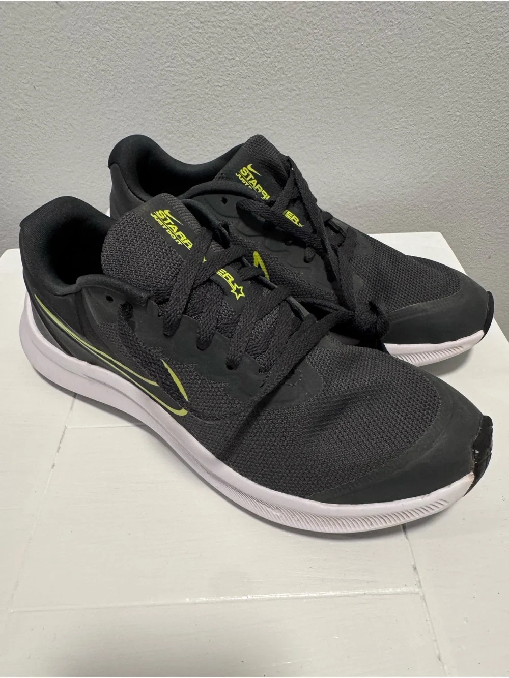 Nike Black Sneakers with Neon Yellow Swoosh and White Sole